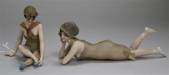 A pair of French risque tinted biscuit porcelain figures of female bathers, early 20th century, length 15cm and 7.5cm